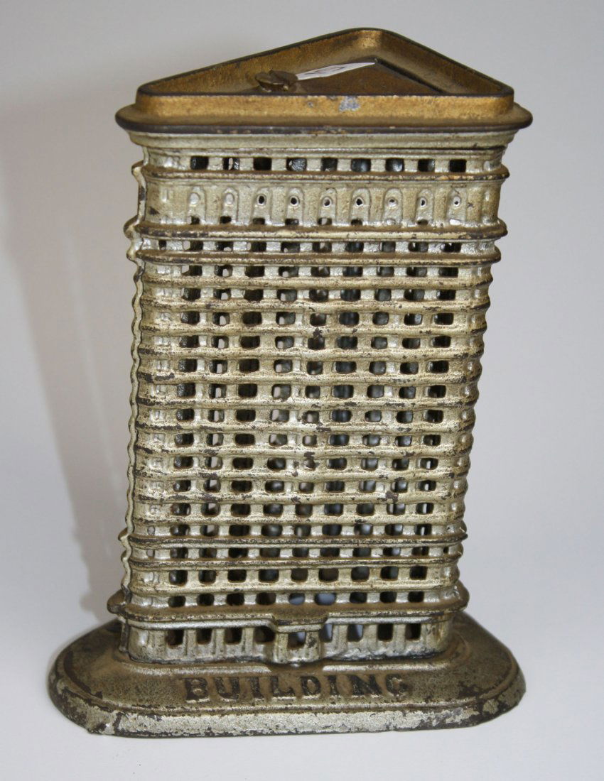 Circa 1905 Flat Iron Building cast iron Bank 6" size ": Circa 1905 Flat Iron Building cast iron Bank 6" size " Flat Iron Building Bank" embossed on base. In original silver and black paint