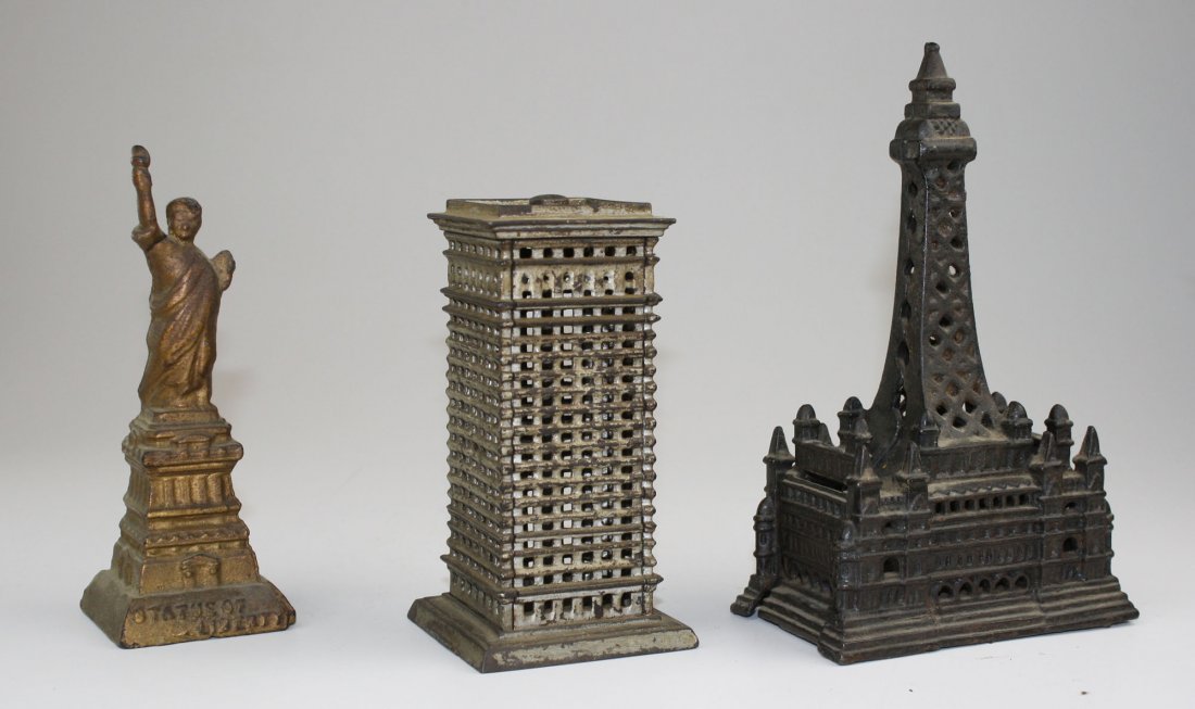 Three building cast iron building banks Statue of: Three building cast iron building banks Statue of Liberty 6", Skyscraper 5.5", Blackmoor tower 7"