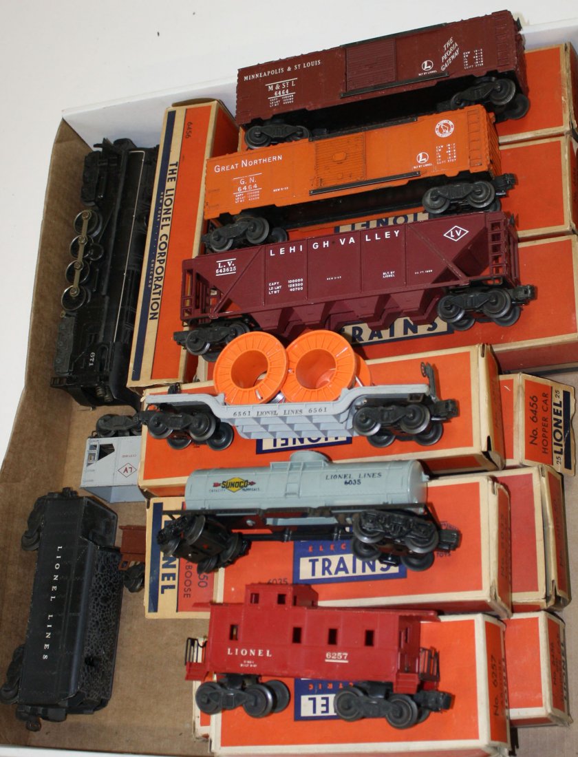 Lionel O Gauge No. 671 locomotive, 6466 tender, and 10: Lionel O Gauge No. 671 locomotive, 6466 tender, and 10 pcs of rolling stock w/ original boxes- 6035 tank car, 6119-50 work caboose, 6257 caboose, 6436 hopper, 6456 red hopper (x2), 6456 grey hopper, 6