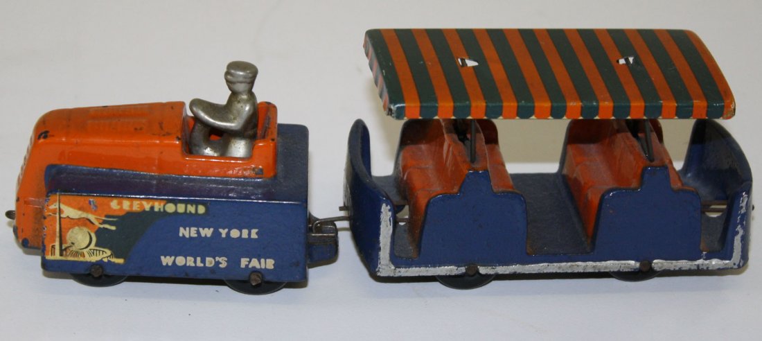 Arcade 1939 New York World's Fair Train tractor & one: Arcade 1939 New York World's Fair Train tractor & one car-cast iron & tin litho, length 7.5”