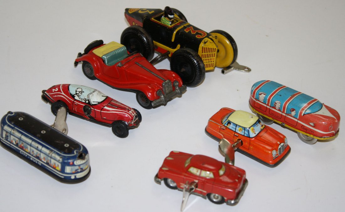 6 Marx, Cragston,etc tin litho wind-up cars, buses, &: 6 Marx, Cragston,etc tin litho wind-up cars, buses, & race cars-various conditions, lengths 3”- 5”