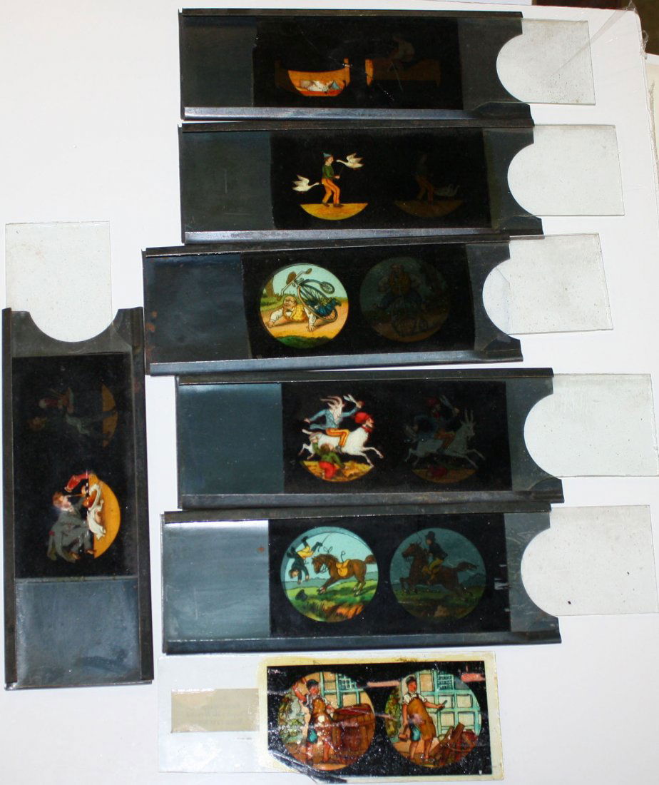 Seven- Two panel magic lantern slides with tin and wood: Seven- Two panel magic lantern slides with tin and wood holders, comic scenes of injury and misfortune. Bike crashes, occupational mishaps etc.