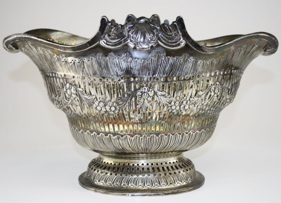 1891-92 Francis Boone Thomas London sterling silver: 1891-92 Francis Boone Thomas London sterling silver reticulated and repousse gadrooned footed centerpiece bowl w/elephant cartouche 10” x 16.5” 60 troy oz