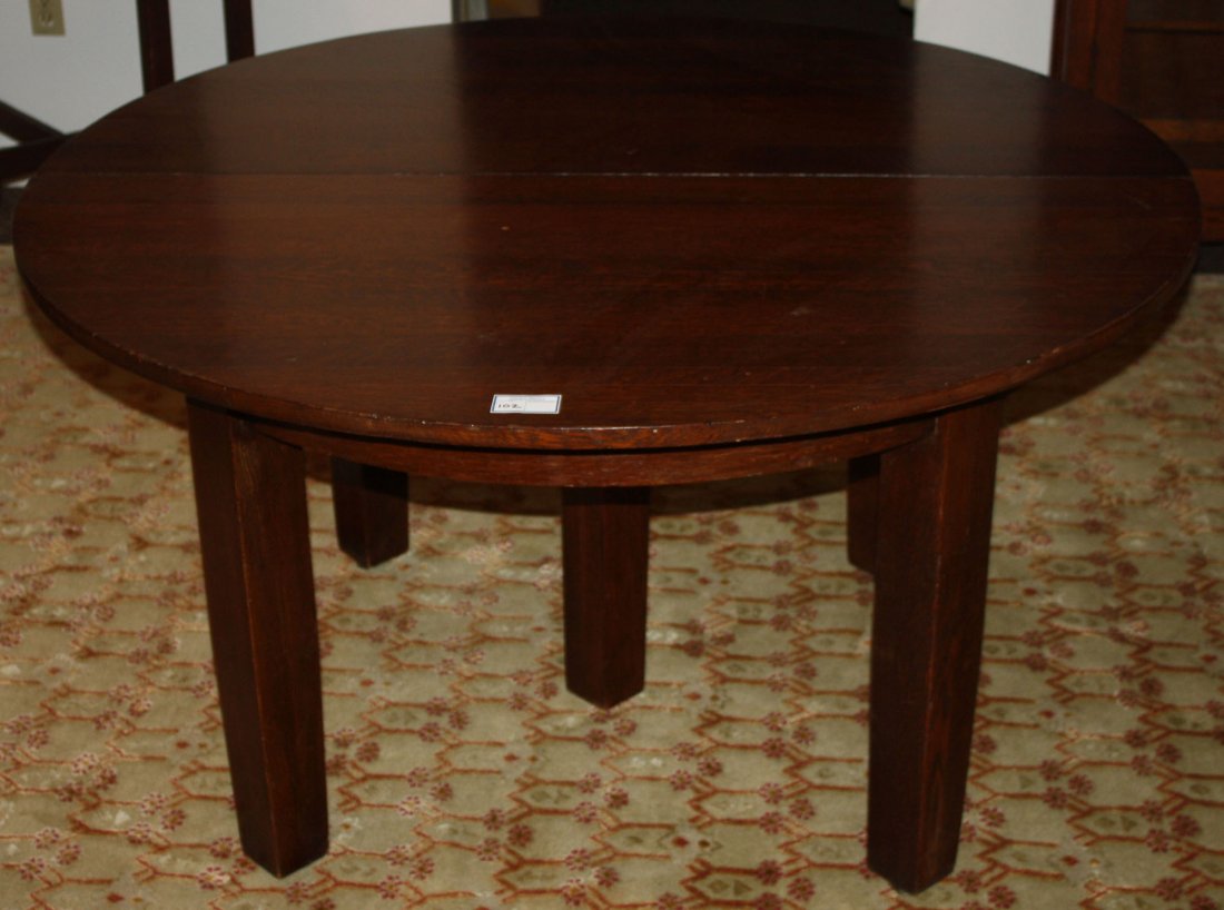Stickley #632 oak 5 leg extension table. 54" diameter.: Stickley #632 oak 5 leg extension table. 54" diameter.