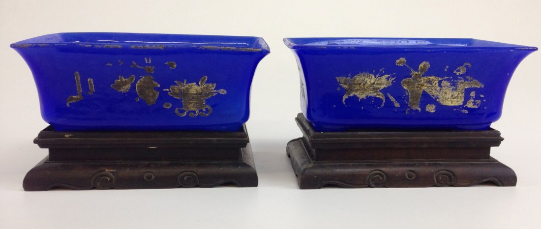 Pair Chinese blue rectangular glass bowls/pots with: Pair Chinese blue rectangular glass bowls/pots with gilt flower & grass decoration. Worn. 7 1/2" x 5" x 3". Sold to benefit Hood Museum of Art.