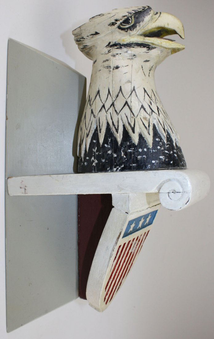 carved wooden eagle's head mtd on wall plinth w/: carved wooden eagle's head mtd on wall plinth w/ Federal shield