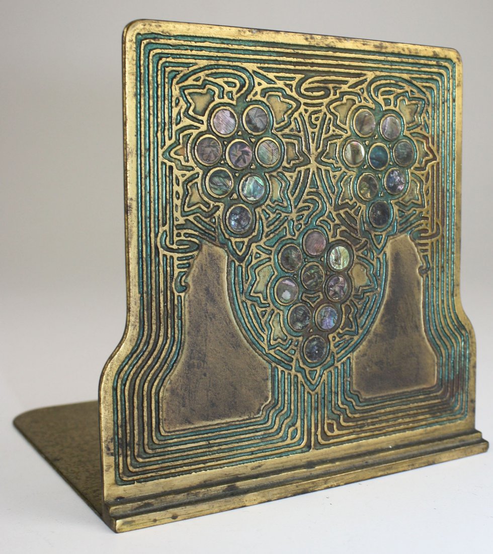single Tiffany Studios New York brass bookend w/ gold: single Tiffany Studios New York brass bookend w/ gold dore finish w/ mother of pearl accents # 1173- ht 5.5”
