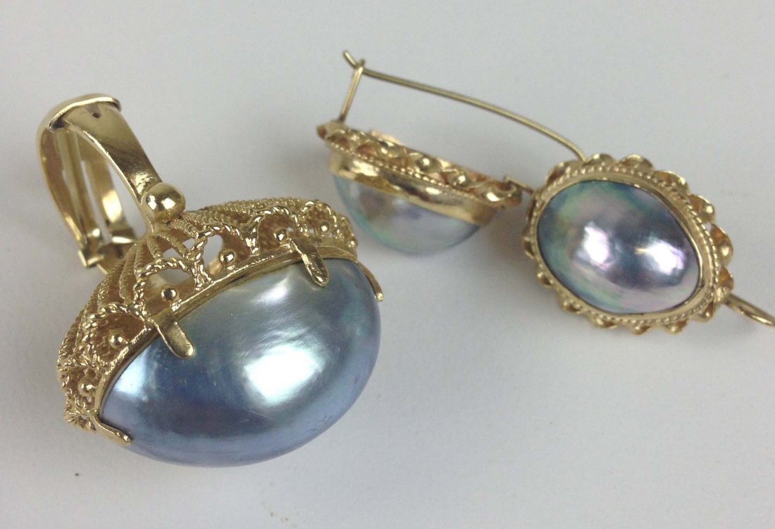 14k y.g. ring & pair earrings having twist designs: 14k y.g. ring & pair earrings having twist designs surrounded by grey oval abalone. 26mm & 16mm, 18.2grm