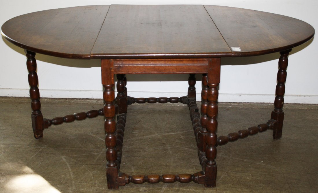 17th c oak sausage turned gate leg oval drop leaf: 17th c oak sausage turned gate leg oval drop leaf table, top of later date. 51"l open 69"x 29"h.
