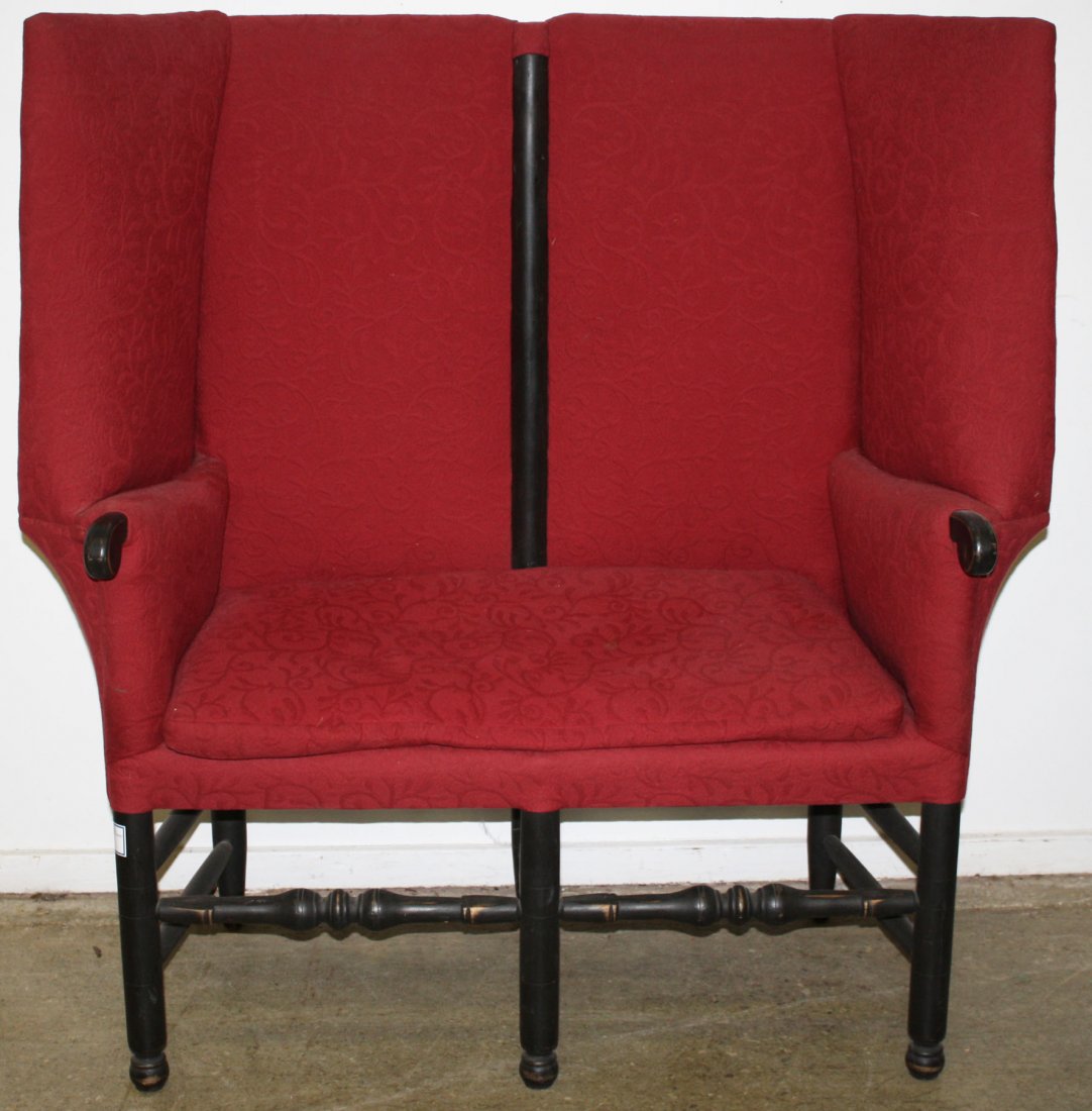 18th c style wing back red upholstered two seat tall: 18th c style wing back red upholstered two seat tall back settee, turnings painted black. Late 20th c. 50"w x 46"h.
