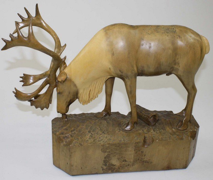 Denis Dube- Canadian wood carving of a caribou bull- ht: Denis Dube- Canadian wood carving of a caribou bull- ht 19”, length 16”