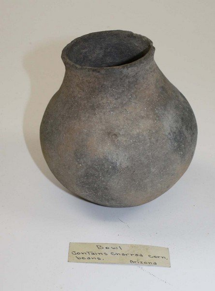early SW Indian pottery bowl containing fragments of: early SW Indian pottery bowl containing fragments of charred corn & beans- descending from an old Tucson, AZ family- dia 59”, ht 5.5”