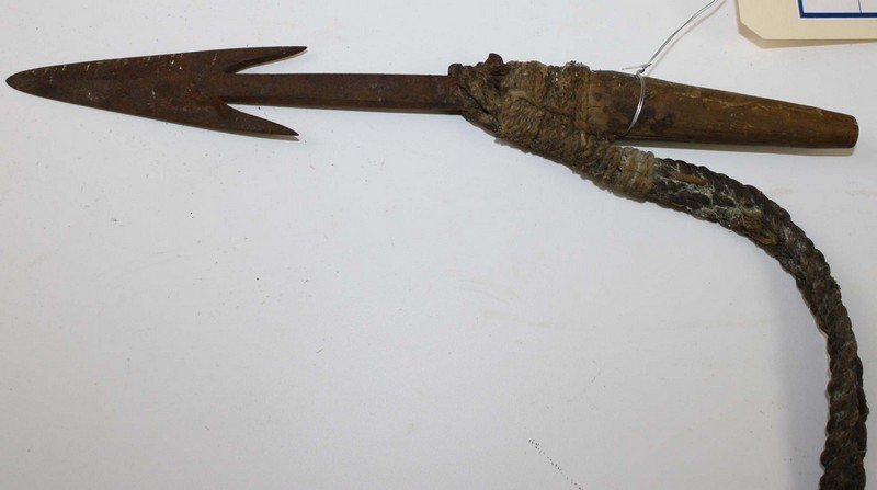 19th c Alaskan/ Inuit detachable harpoon tip (for: 19th c Alaskan/ Inuit detachable harpoon tip (for hunting sea mammals), retains original hand woven cordage- overall length13.5”, blade length 7.75”