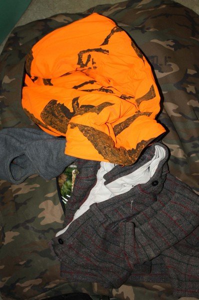 Lot of outdoor clothing. Much camoflage many pair of: Lot of outdoor clothing. Much camoflage many pair of gloves Sneaky leaves all in stuff sack