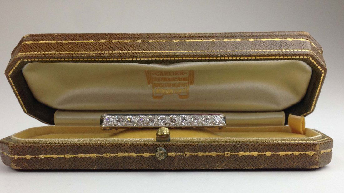 Signed Cartier O.C.C. diamond bar pin having 11 old (1 of 2)