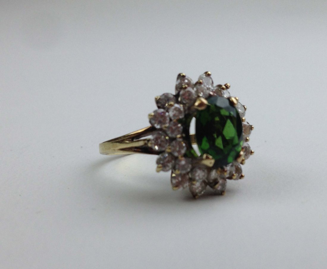Ladies 14k y.g. emerald and diamond rind. Center stone (1 of 1)
