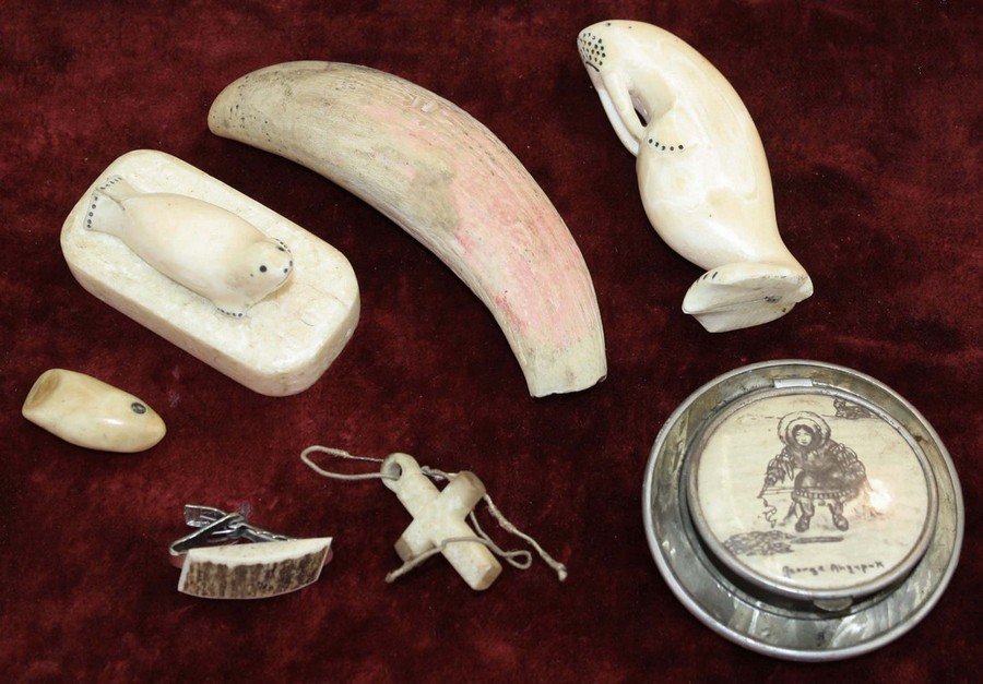 Lot of scrimshaw Eskimo/Inuit whale carvings including: Lot of scrimshaw Eskimo/Inuit whale carvings including seal 2", walrus 3", sperm whale tooth 4". 4 small pieces.