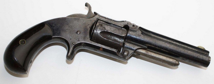 Smith and Wesson .32cal Model 1- second issue standard: Smith and Wesson .32cal Model 1- second issue standard pocket revolver. Good original blue. Rosewood grips. SN 116908. 7"l. 3" barrel. To be sold according to Federal ATF regulations.