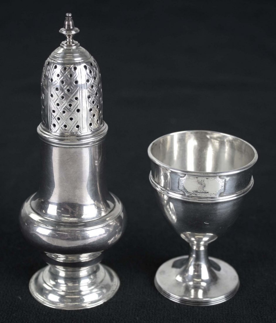 Small lot of Georgian silver. George III pepper pot.: Small lot of Georgian silver. George III pepper pot. Hallmarked R fleur de lis P, London, 1763, Robert Peaston. "AT" on base. George III egg cup. Hallmarked London, 1792, maker's mark illegible. Engra