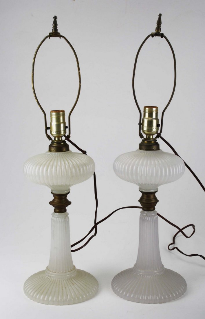 pr of ribbed clambroth oil lamps with brass rings, ht: pr of ribbed clambroth oil lamps with brass rings, ht 13.5”, Dr Oliver Eastman collection, one top separated from base
