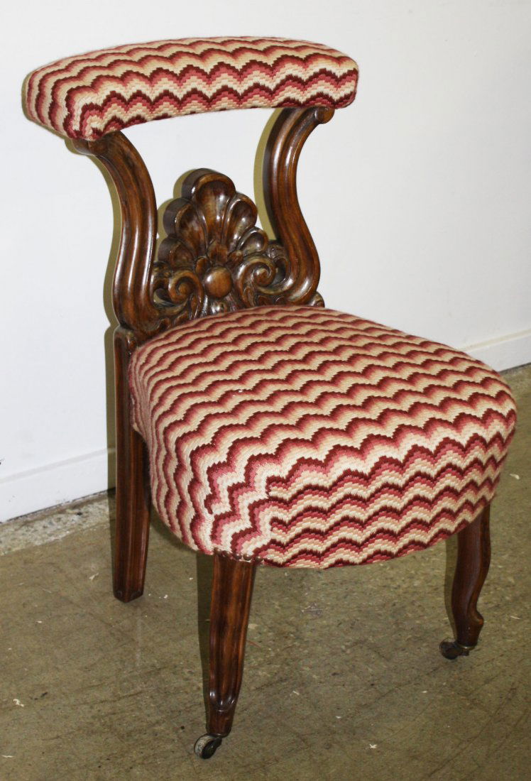 19th Victorian carved walnut upholstered library chair. (1 of 1)