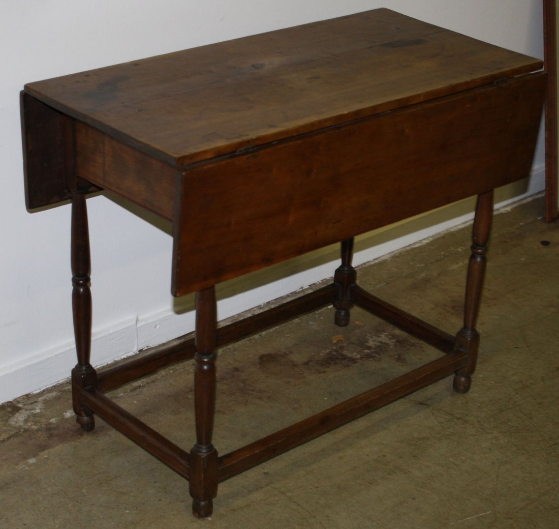Good Queen Anne stretcher base drop leaf table boxed: Good Queen Anne stretcher base drop leaf table boxed slides. Signed "table made by Alexander Cuttingham of ? March 13, 1772." Probably Connecticut River Valley.