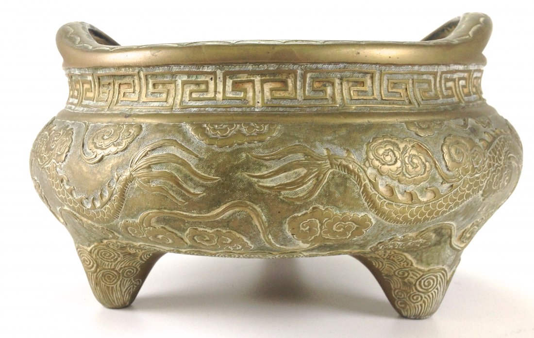 Chinese bronze dragon decorated footed low incense: Chinese bronze dragon decorated footed low incense bowl, character signed 7.5" x 4"