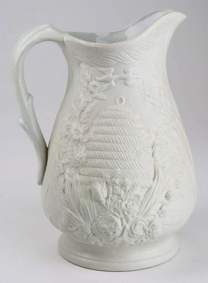 19th c. Parian pottery pitcher with embossed beehive: 19th c. Parian pottery pitcher with embossed beehive and kissing doves 10" x 7"
