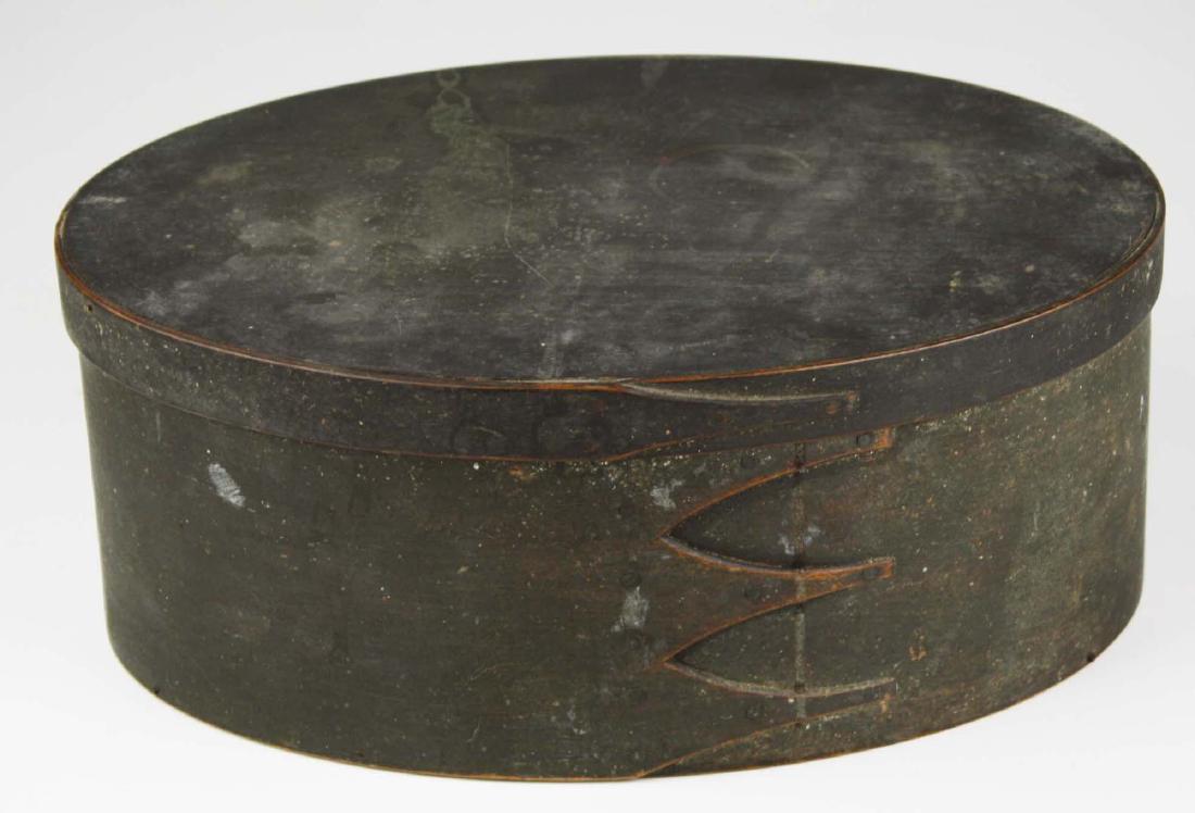 19th c Shaker oval box in old green paint: 3 fingers, length 11 3/4 inches, ht 4 3/4 inches