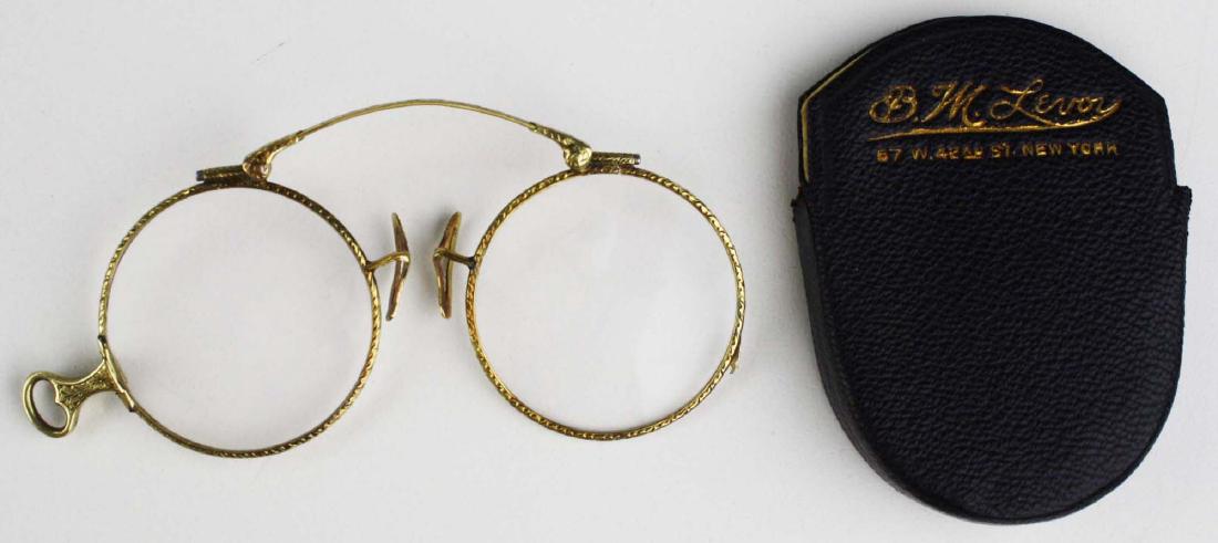 Pair of 19th c 14k folding eye glasses.: Pair of 19th c 14k yellow gold folding eye glasses with fine filigree work.