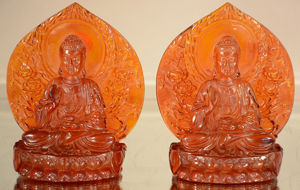 Chines Red Amber Bookends with Seated Religious Figure (1 of 3)