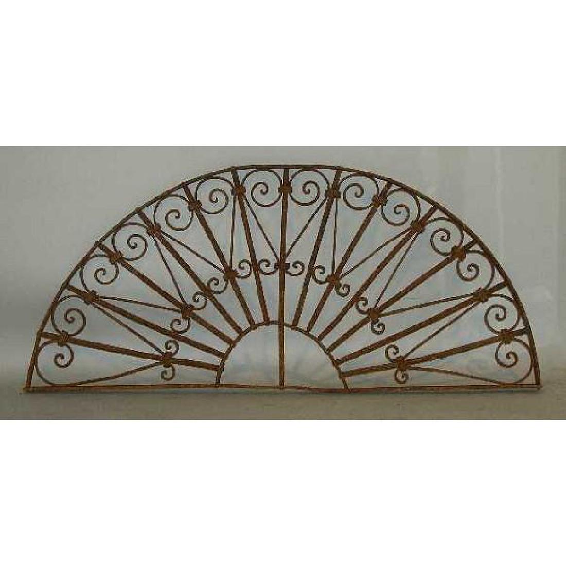 French Colonial Wrought Iron Arched Transom Grille: DATE c. 1880-90 DIMENSIONS Width 47 Depth 1.5 Height 20 in.