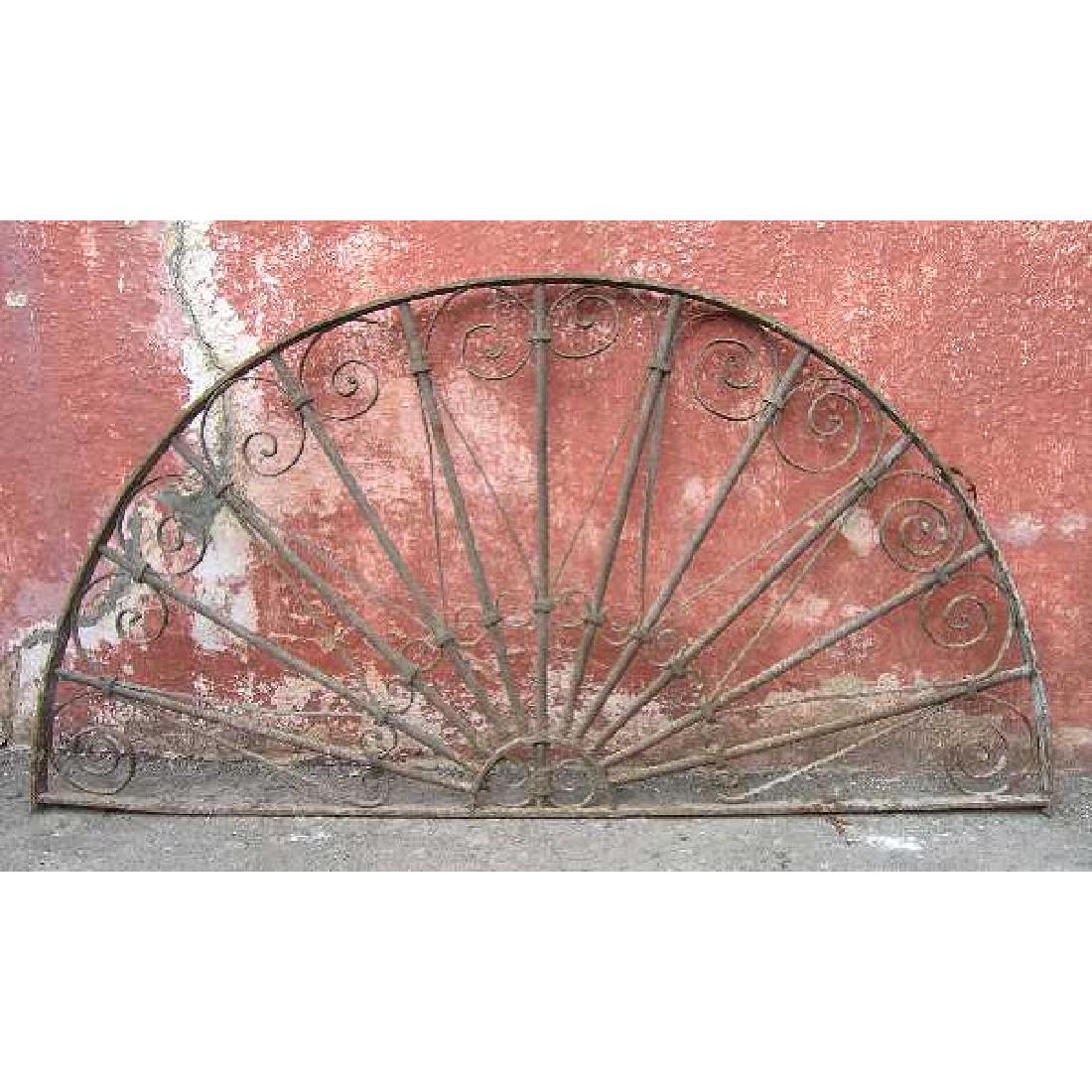 French Colonial Wrought Iron Arched Transom Grille: DATE c. 1900 DIMENSIONS Width 59 Height 30 in.