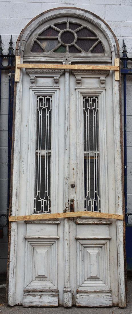 French Oak Entry Door with Stained Glass Transom: with iron panels Dimensions: 137" x 49" Date: Ca. 1900
