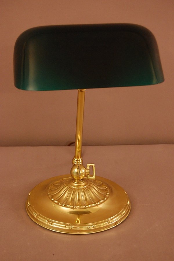 "Emeralite" Desk Lamp: "Emeralite" Desk Lamp , Double Adjustable base for roll top Desk, Polished brass, all original with stencil on back of Green Case Glass Shade ca. 1900 13" t x 9" d
