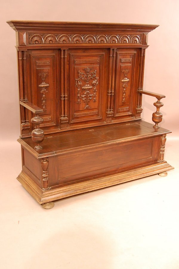 Renaissance Walnut Hall Seat: Renaissance Walnut Hall Seat , Carved Floral And Arches on Crest, triple Back Panels with carved urns lift top seat. Ca. 1880 56" lt x 54'L x 19" d