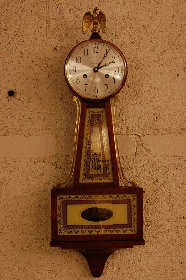 Seth Thomas Banjo Style Wall Clock: Seth Thomas Banjo Style Wall Clock, Walnut Case, brass eagle on top, original stencil in door, ca 1920, 29"t X 10"w X 3"d