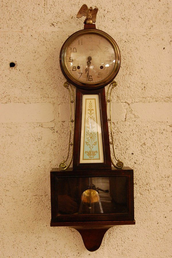 New Haven "Whitney" Banjo Style Wall Clock: New Haven "Whitney" Banjo Style Wall Clock, Mahogany case brass inlayed top, eight day movement, time and strike, ca 1820, 29"t X 20"w X 4"d