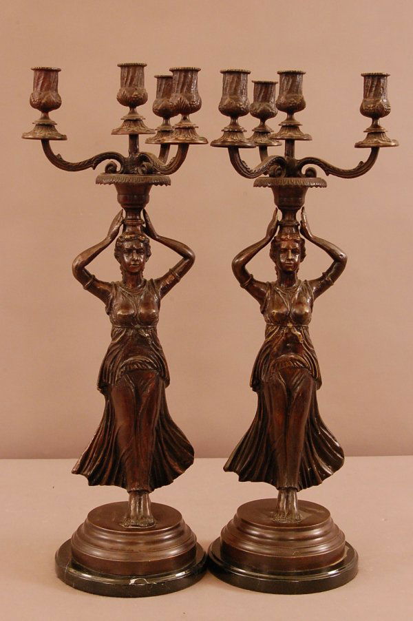 Pair of Figural Bronze Candleabras: Pair of Figural Bronze Candleabras, with maidens holding up candles, 25"w X 9"d