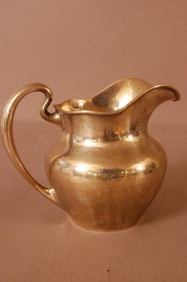 Sterling Silver 2 1/2 pint milk pitcher 6"T x 8: Sterling Silver 2 1/2 pint milk pitcher 6"T x 8"W. Ca. 1920