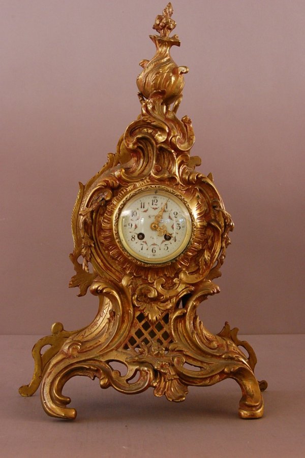 French Dore Bronze Shelf Clock. Classic French De: French Dore Bronze Shelf Clock. Classic French Design, Porcelain Dial, works signed f & C, astra succ.dea mougin, 23 1/3" H x 15"L x 6 1/2" d ca. 1880