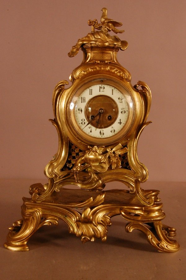 French dore Bronze Shelf Clock. Bird Sitting on t: French dore Bronze Shelf Clock. Bird Sitting on top. Porcelain Diall. Works signed GF. 21 1/2" T x 16"L x 8"D ca. 1860