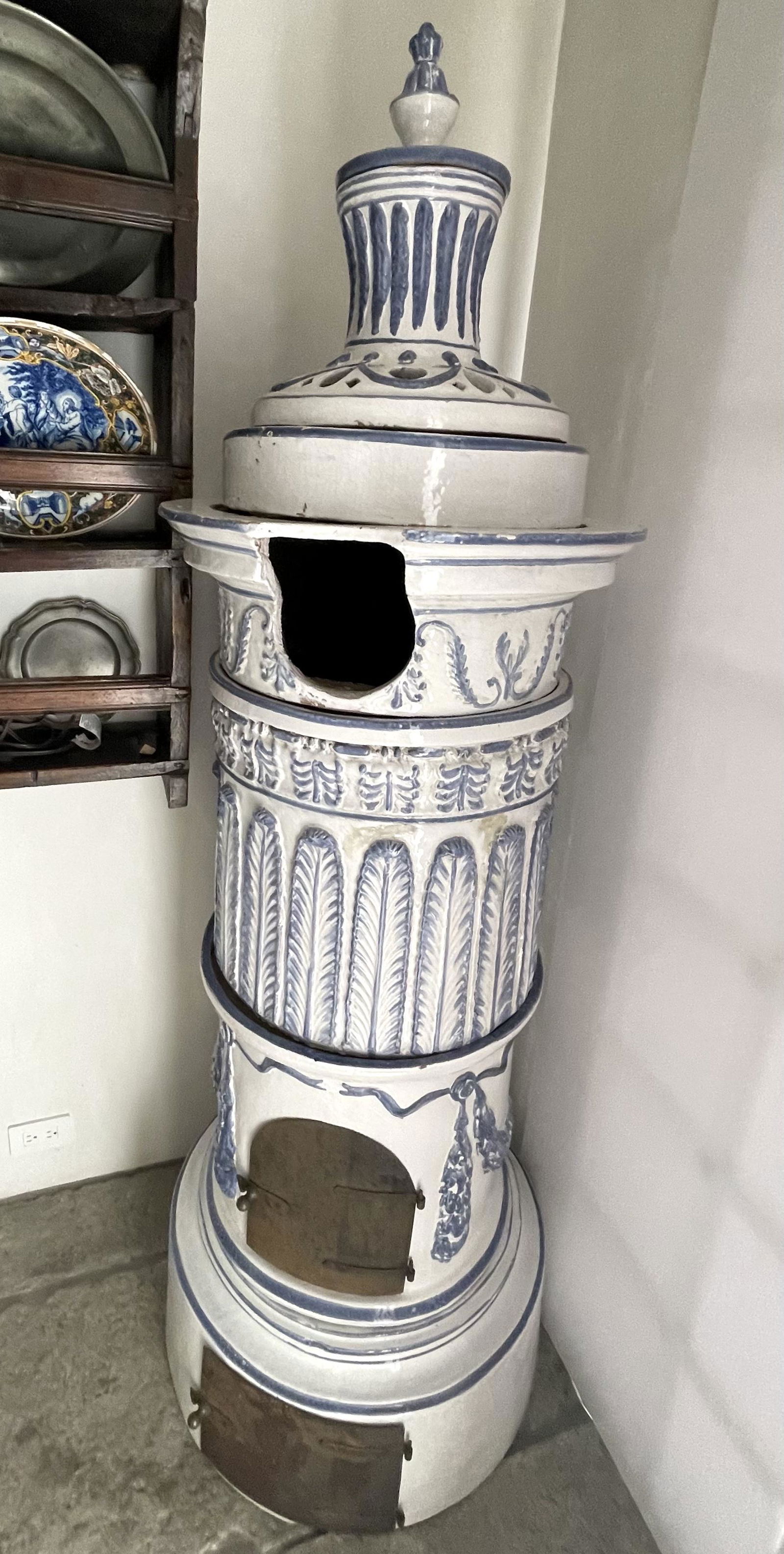 Exquisite Swiss Antique "Kachelofen" Tile Stove: Period: 19th century Origin: Switzerland Description: porcelain tile stove & fireplace. Dimensions: 80"t x 21"w