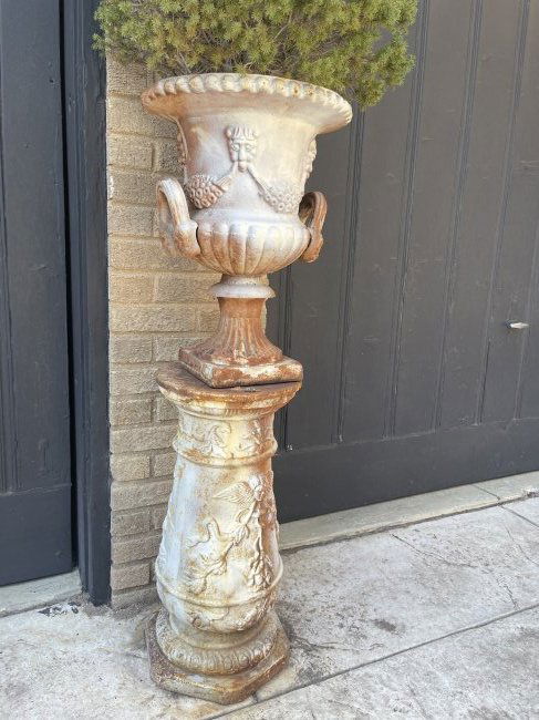 Pair of Cast Iron Urns on Iron Bases: Period: 20th century; Origin France; Pair of cast iron urns on pedestals. 50” t 23”w