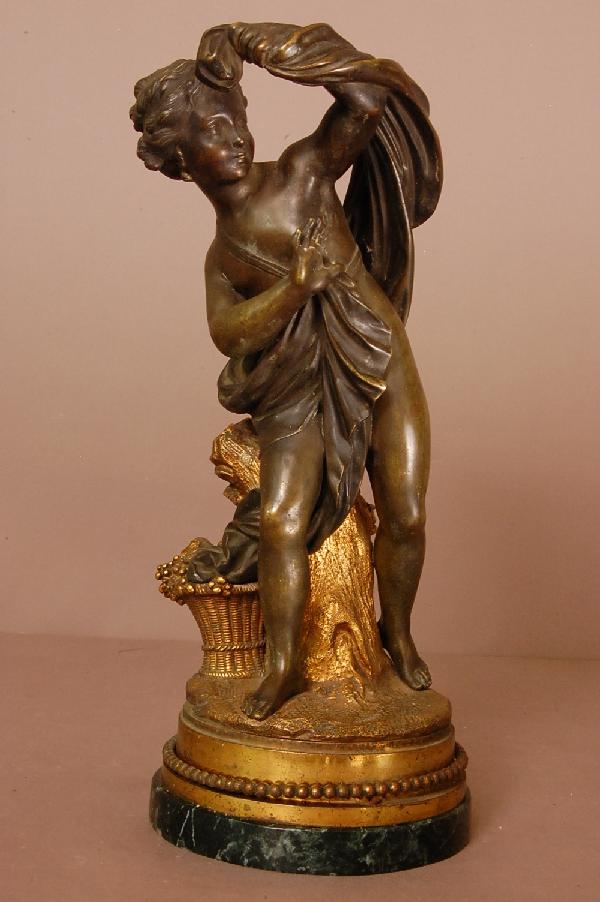 French Figural Bronze Statue: French Figural Bronze Statue, patined bronze, female figure mounted on dore bronze base. 14" t x 6" w ca. 1900