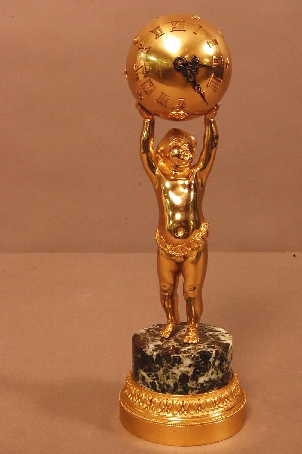 French Bronze Figural Ball Clock with chilc holdin: French Bronze Figural Ball Clock with chilc holding up clock. Standing on marble & bronze base. Works signed E.D. Ca. 1880 11" t x 3" w Ca. 1880