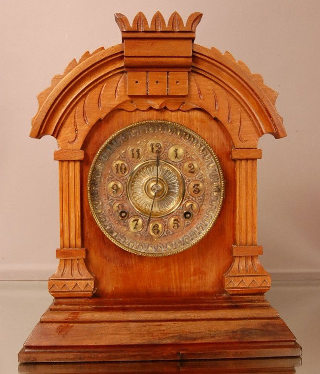 Ansonia "Tunis" model shelf clock. Walnut case, Em: Ansonia "Tunis" model shelf clock. Walnut case, Embossed Brass Dial, Time & Strike, 8 Day movement, signed on movement Ansonia Clock Co. 1880 14" t x 11 1/2" w x 5" d