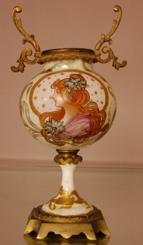 Art Noveau Style Serves Porcelain Vase. Portrait : Art Noveau Style Serves Porcelain Vase. Portrait of woman. Artist signed Hitey. Dore Bronze mounts. 8 1/2" t x 4" w. Ca. 1900