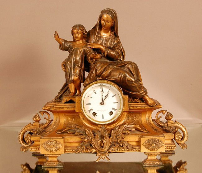 Seth Thomas & Figural Mantel clock. Spelter statu: Seth Thomas & Figural Mantel clock. Spelter statue of Mary & Jesus. Porcelain Dial Time & Strike 16" t x 18" w x 7" d. Ca. 1875