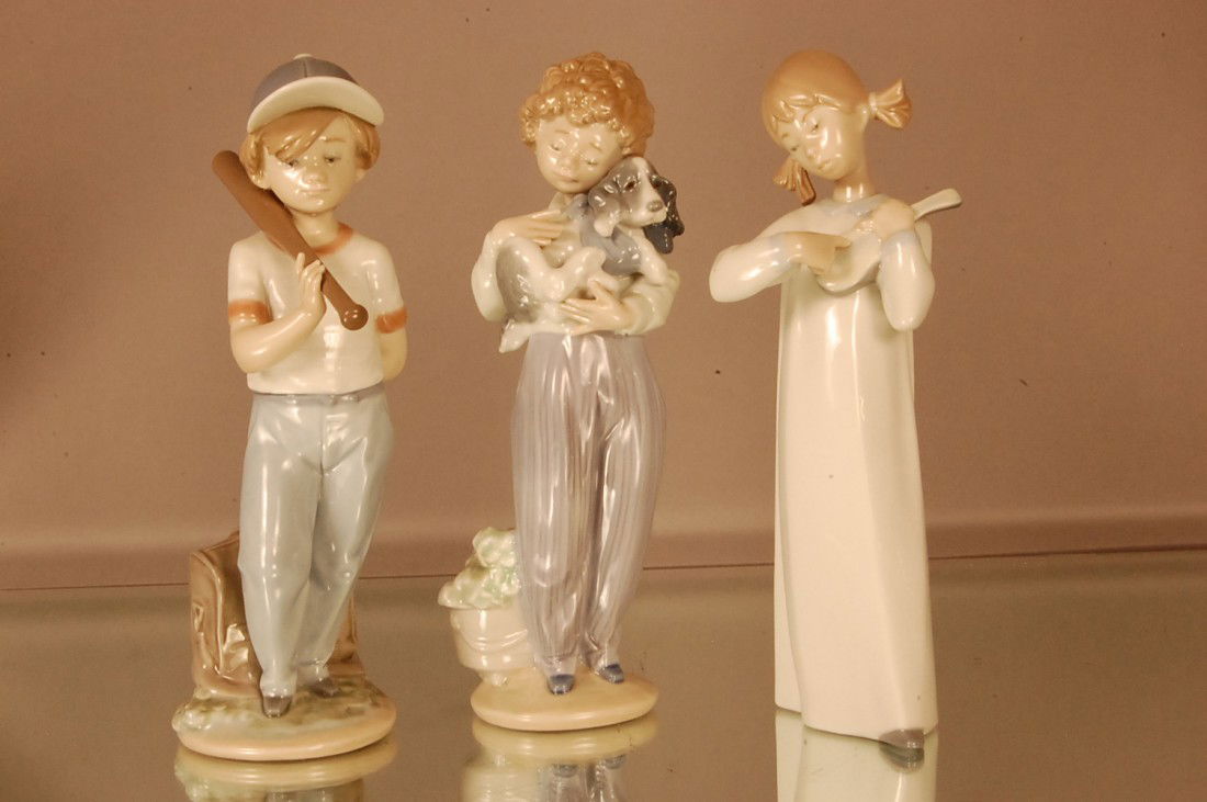 3 Llardo porcelain statues. Boy with Bat. 8" t x: 3 Llardo porcelain statues. Boy with Bat. 8" t x 5" w Boy with Dog 8" t x 3" w Girl with musical instrument. 8" t x 3" w
